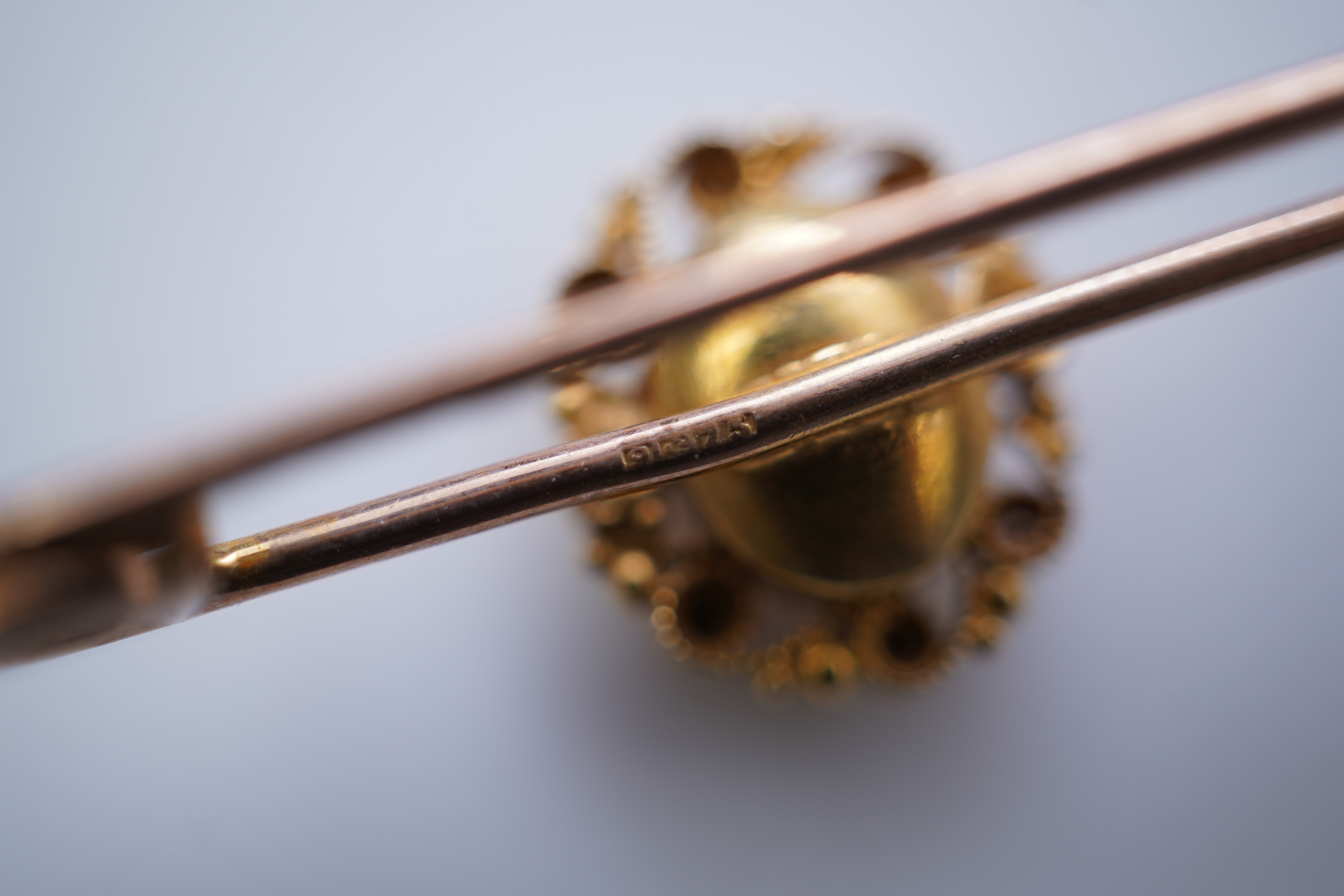 Four gold and gem-set bar brooches, early 20th century